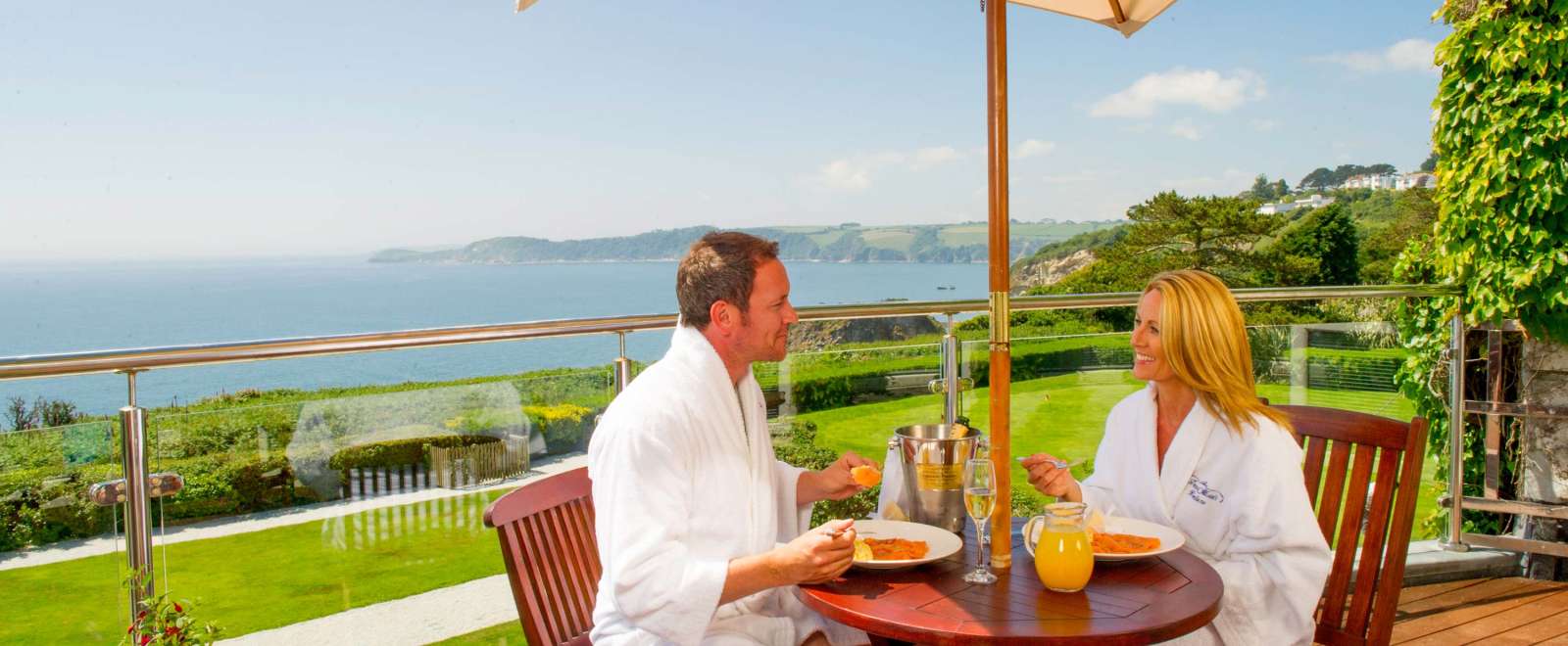 Carlyon Bay Hotel Couple Eating Breakfast and Enjoying the View from Their Balcony