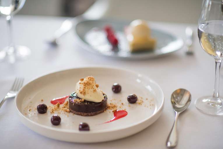 Dark Chocolate Ganache with Amaretto Cream and Cherry Syrup Dessert in the Bay View Restaurant, Carlyon Bay Hotel