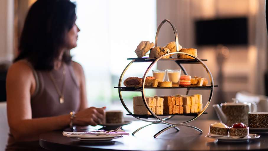 Women enjoying an Afternoon Tea with a pot of tea