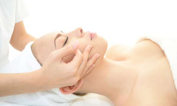 woman having spa treatment facial