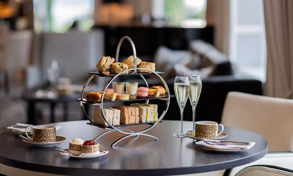 Afternoon Tea with a pot of tea and glass of prosecco